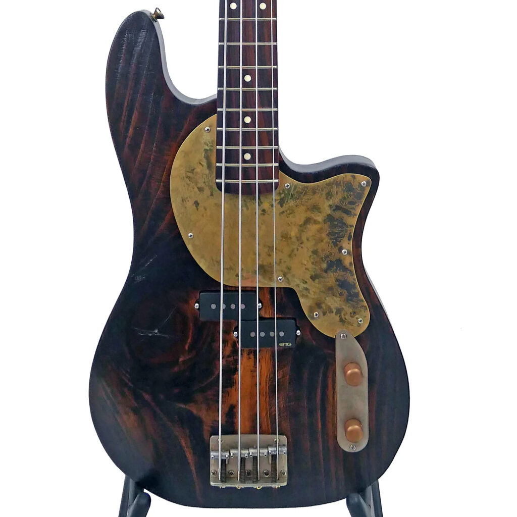 Image of the front of an Offbeat Guitars Priscilla P 34" Long-Scale Bass in Charred Barrel Brown on Distressed Pine with an EMG Geezer Butler P Pickup