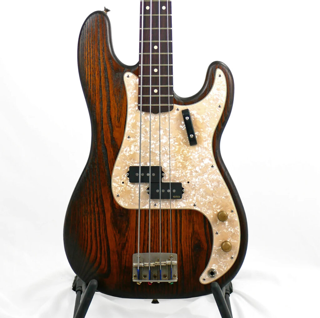Image of the front of an Offbeat Guitars Model P 34" Long-Scale Bass in Vintage Amber Glow on Textured Catalpa