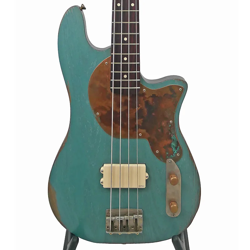Image is of the front of an Offbeat Guitars Priscilla 34" Long-Scale Bass in Teal Green Metallic Relic