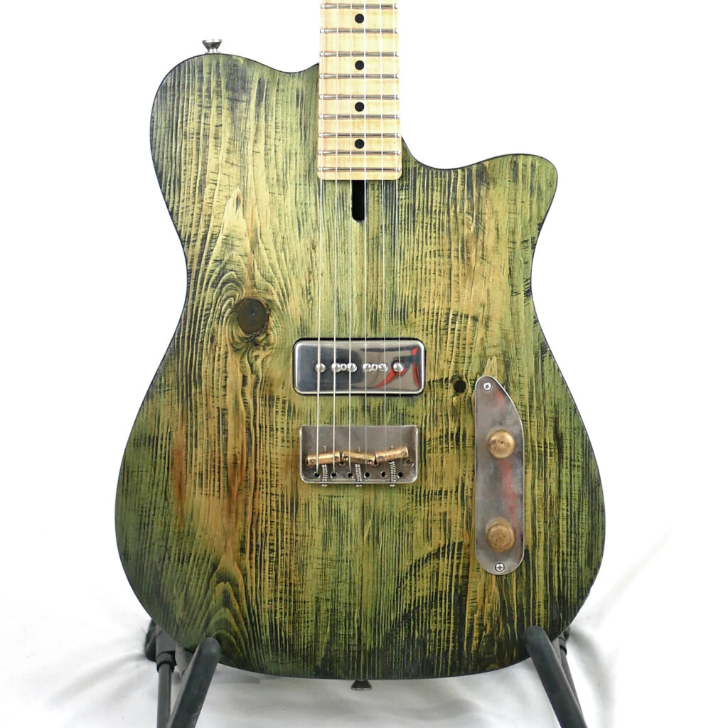 Offbeat Guitars Tish Guitar in Combat Rock Green on Distressed Pine