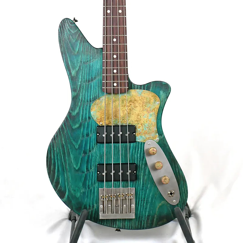 Image of the front of an Offbeat Guitars Jacqueline SB2 32-Inch Medium-Scale Bass in Turquoise Glow on Distressed Pine with Nordstrand Big Single Pickups