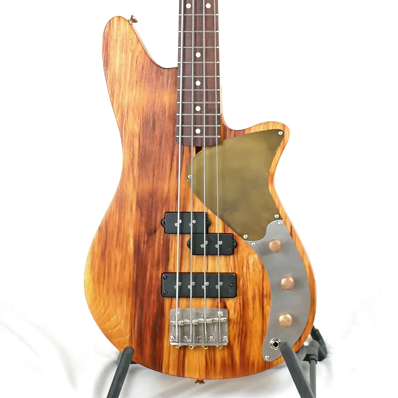 Image of the front of an Offbeat Guitars Marilyn PSB 32-Inch Medium-Scale Bass in Butterscotch Candy on Textured Pine with Nordstrand NP4A and Big Split Pickups