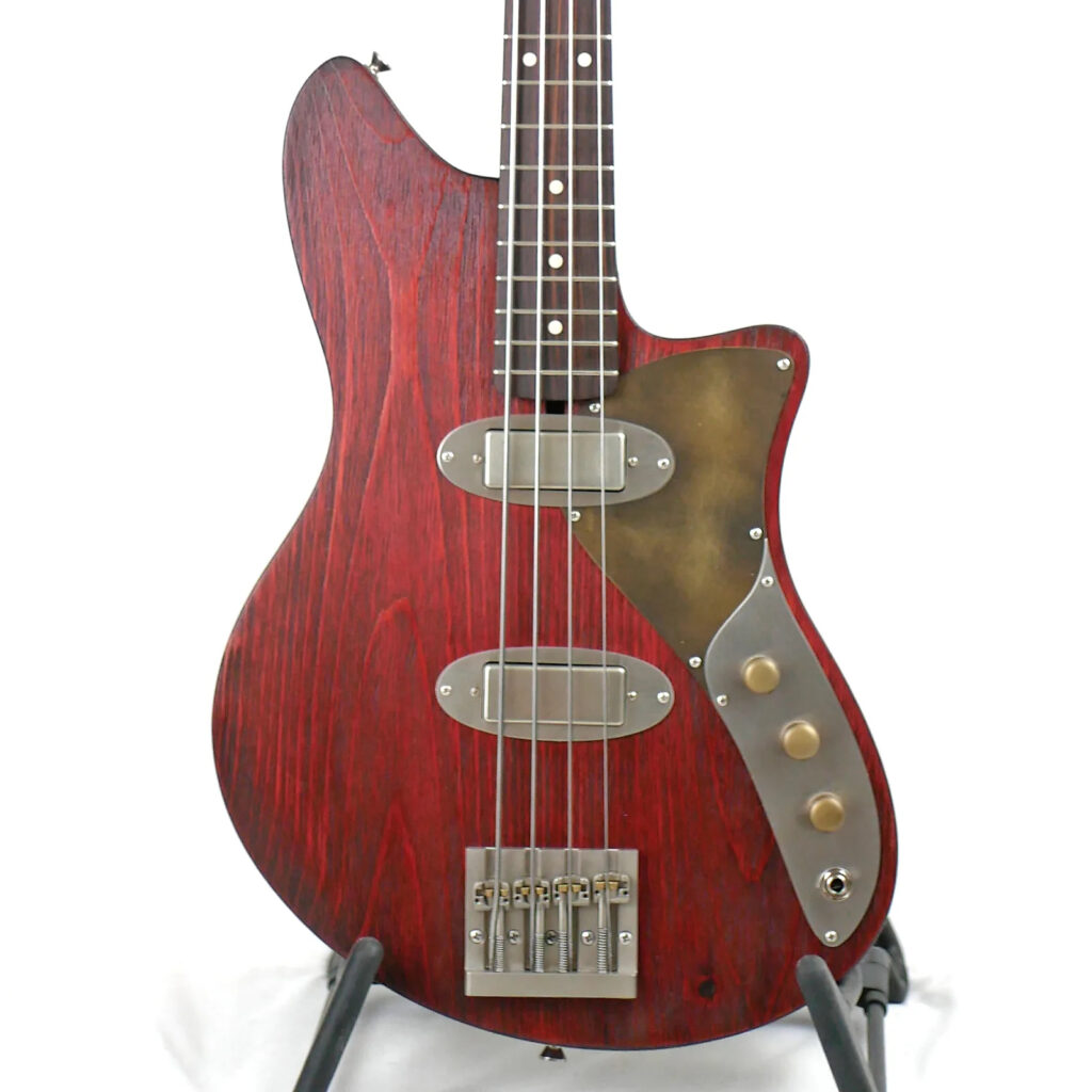 Image is of the front of a Beatrix MH2 30" Short-Scale Bass in Vintage Cherry on Textured Pine with Fralin Big Single Mini Pickups
