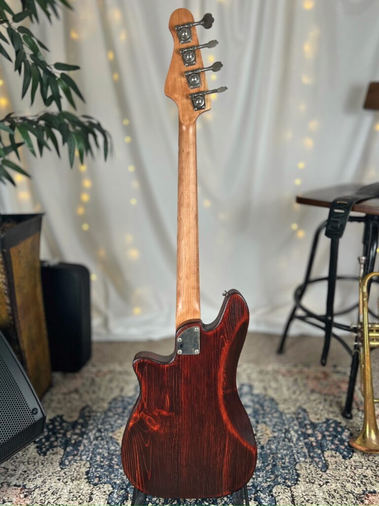 Roxie PJ 30" Short-Scale Bass in Mahogany Red on Distressed Pine